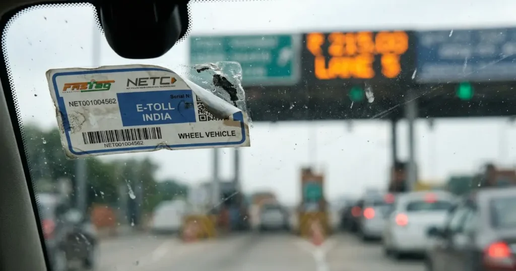 EasyTrip vs Autosweep 2026: Which RFID Do You Actually Need? 9 A photorealistic 4K close-up of an Autosweep or EasyTrip RFID sticker on a car windshield visibly peeling off at one corner and slightly misaligned with a blurred toll booth LED display visible through the glass in background, representing the most common RFID installation mistakes that cause failed cashless toll payment scans at expressway toll plazas operated by SMC Tollways and Metro Pacific Tollways Corp MPTC in the Philippines 2026